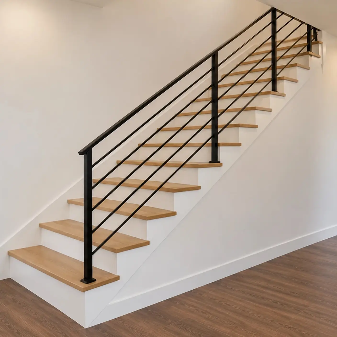 Rendering of the ADU 730 stair from the kitchen: oak treads over white risers climbing along a white wall, with a black horizontal-bar railing.