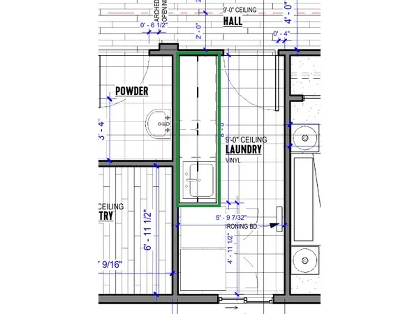 A2.1 · floor plan, boxed in green where it shows what belongs there: A2.1 draws a run of base cabinets under a counter there, with the sink at its end, next to the washer and dryer.