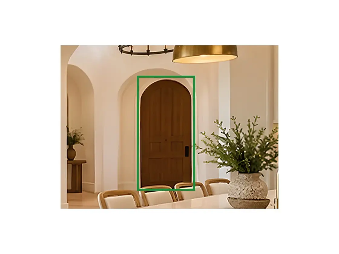 16 · the approved photo, boxed in green where it shows what belongs there: Looking up with the front door at the bottom, the left side is north: A2.1 puts the round-top wood door to the garage there, closed, the door 16 shows through the arch.